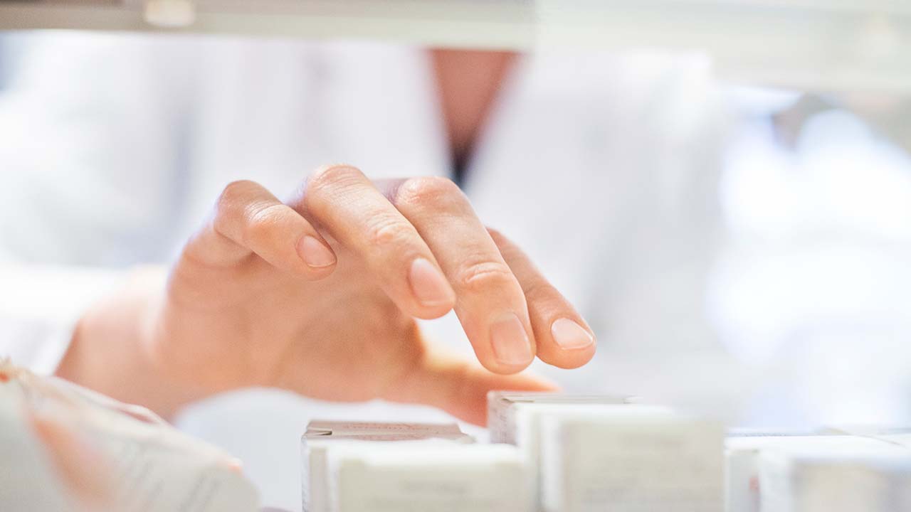pharmacist-hand-on-shelf-summary