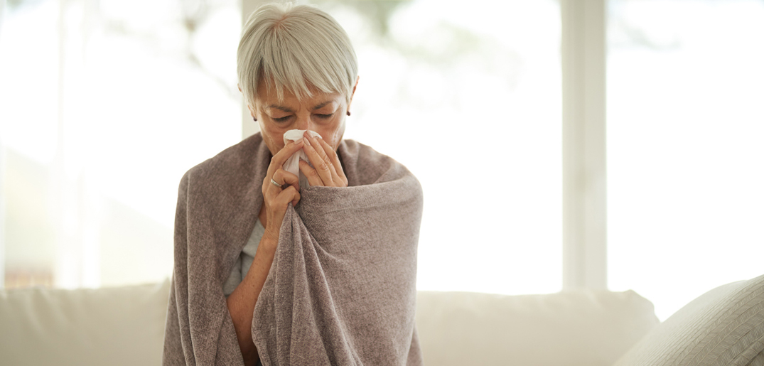 Older woman_cold_blowing nose.jpg